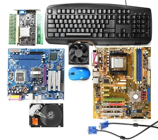 Sell Computer Equipments in Bulk to AS Traders in Hyderabad to efficiently dispose of old hardware while ensuring sustainability and value recovery. The image displays various computer components, including a keyboard, motherboard, cooling fan, hard drive, mouse, and cables. These components appear to be used or scrap items, suitable for resale or recycling.